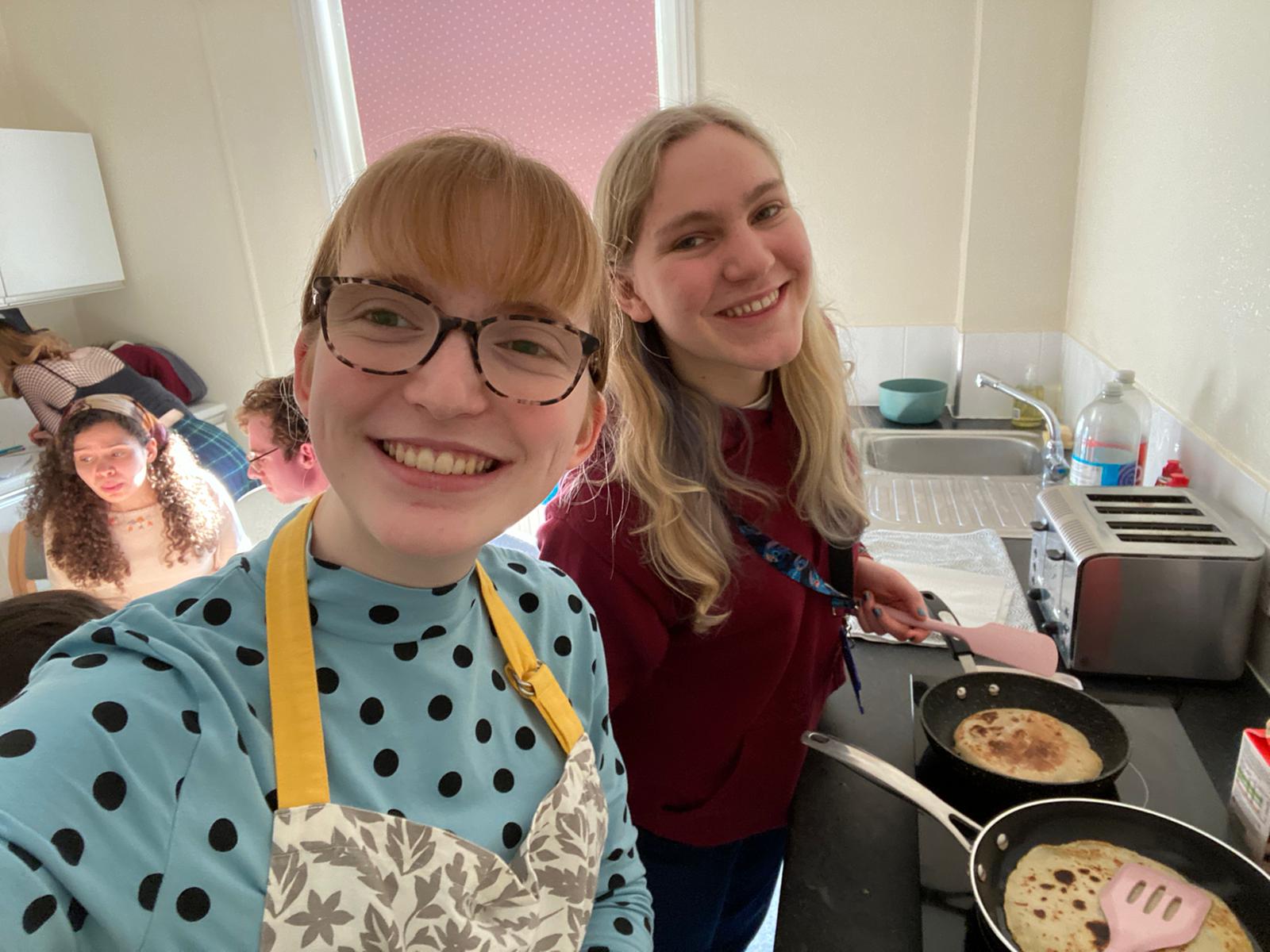 Two students making pancakes