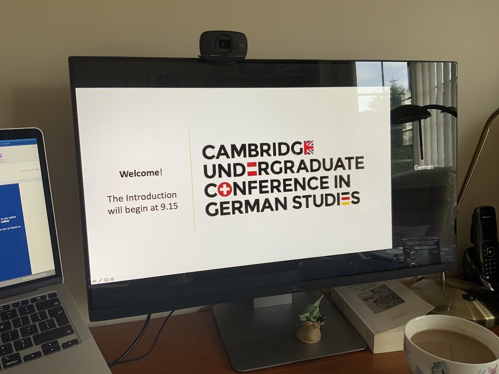 Screen with "Cambridge Undergraduate Conference In German Studies" on it