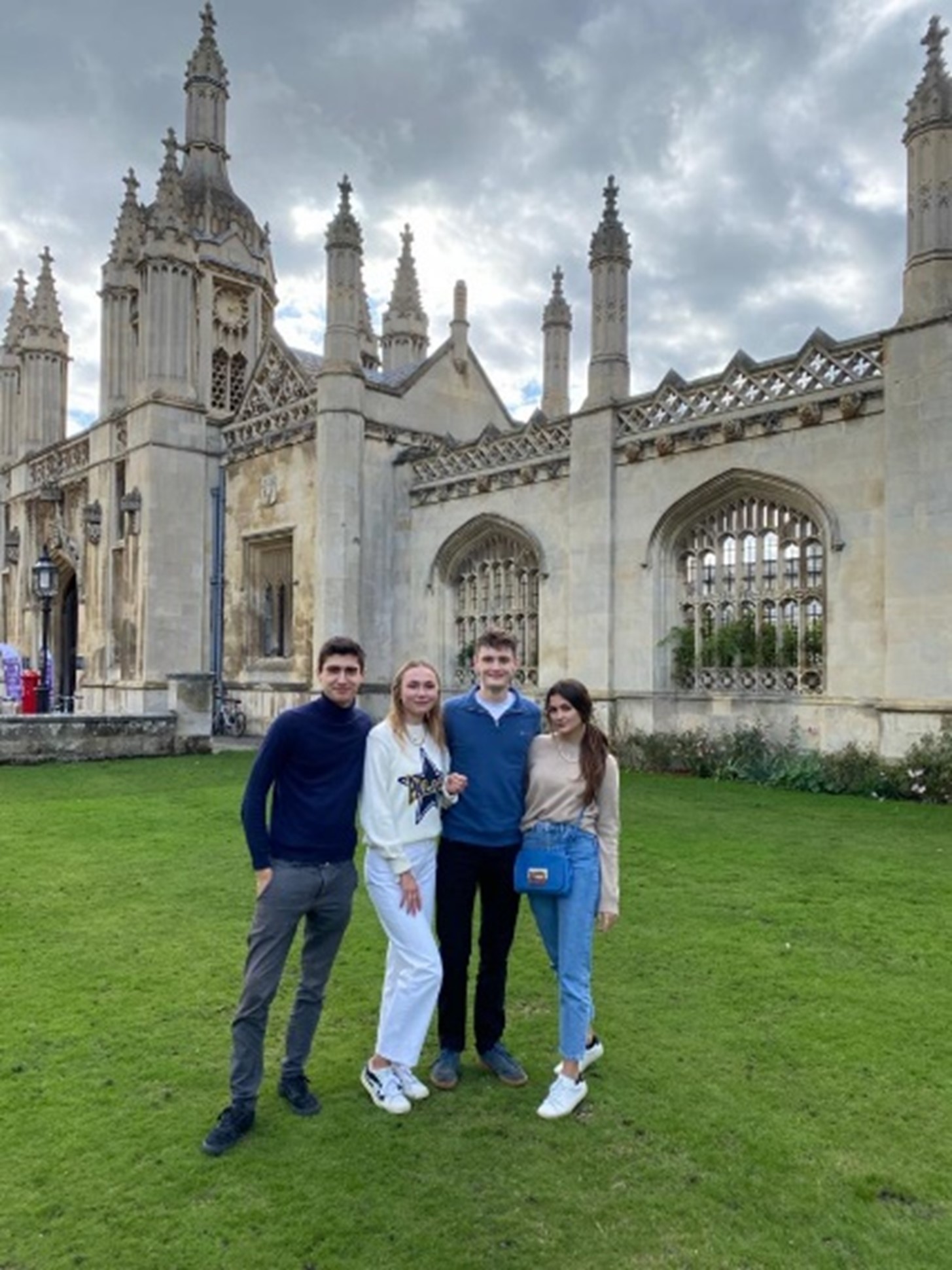 Four students on the lawn outside King's college