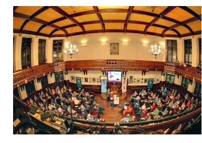 A fish-eye shot of the chamber of the Cambridge Union during a debate on the Arab Spring.