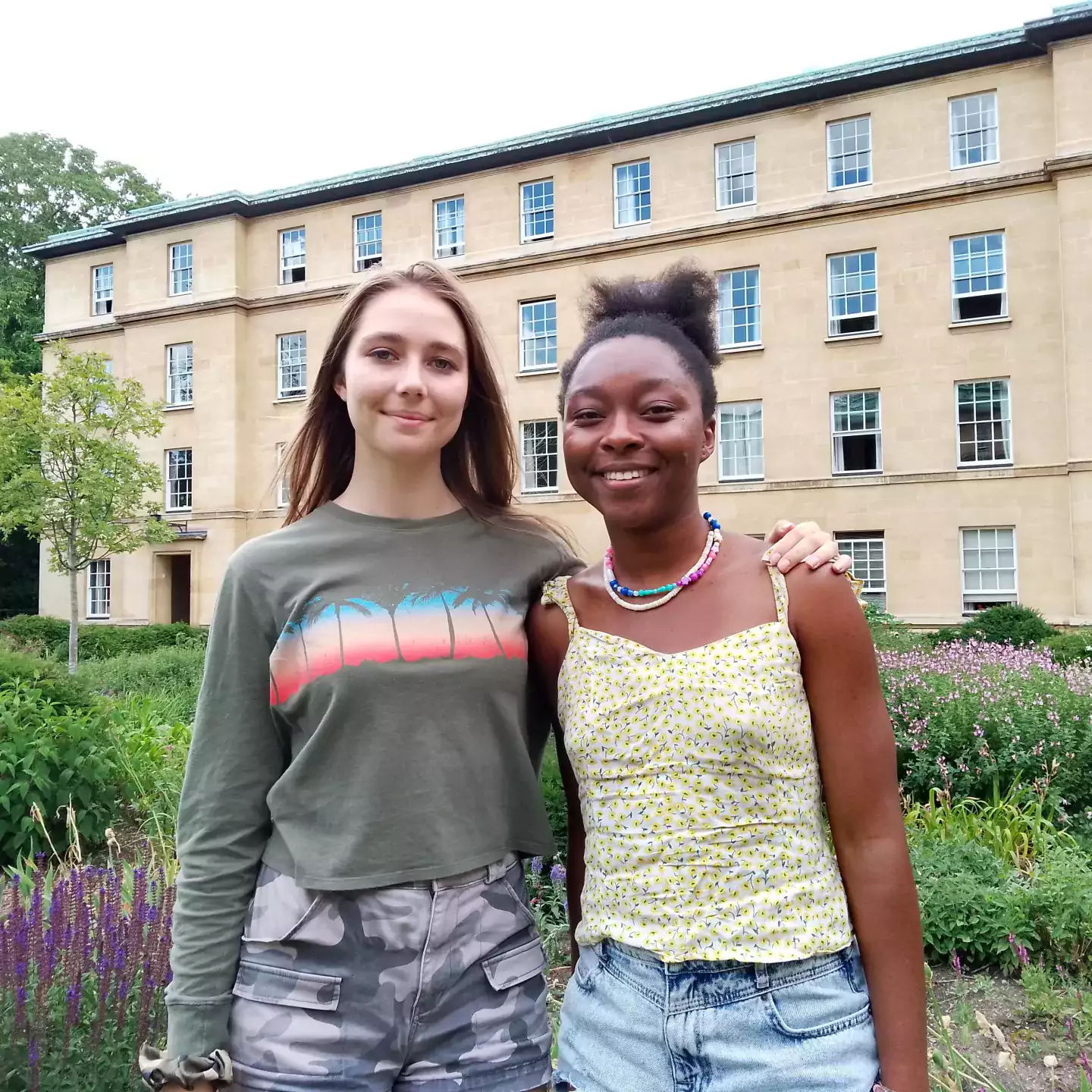 Headshots of Amelia and Adanna in College gardens