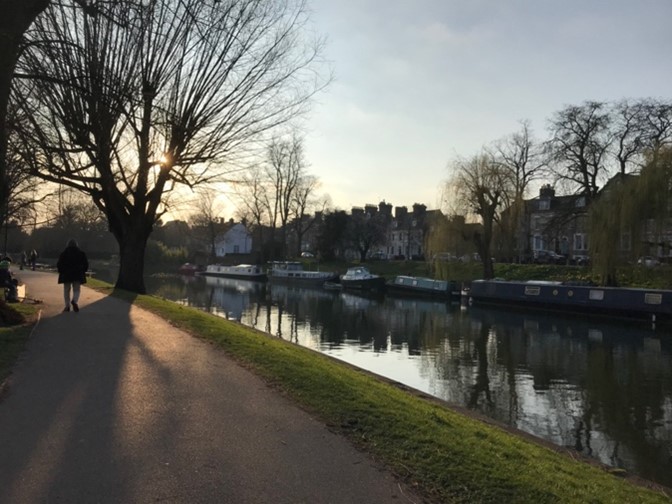 Path by a river at sunset