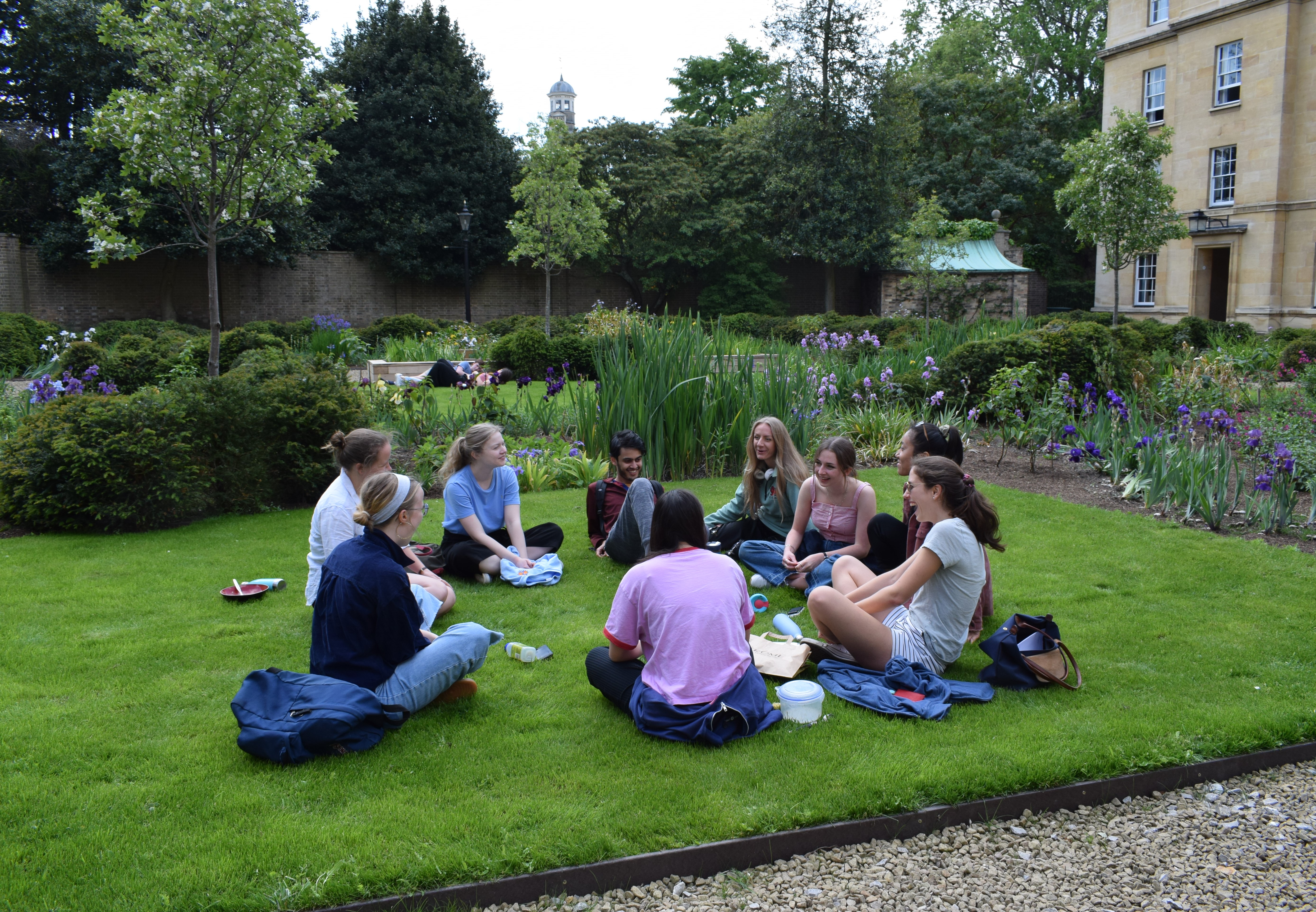 Students sitting on grass in Third Court