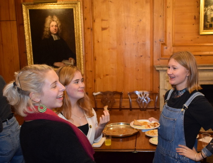 Esme chatting with two other students