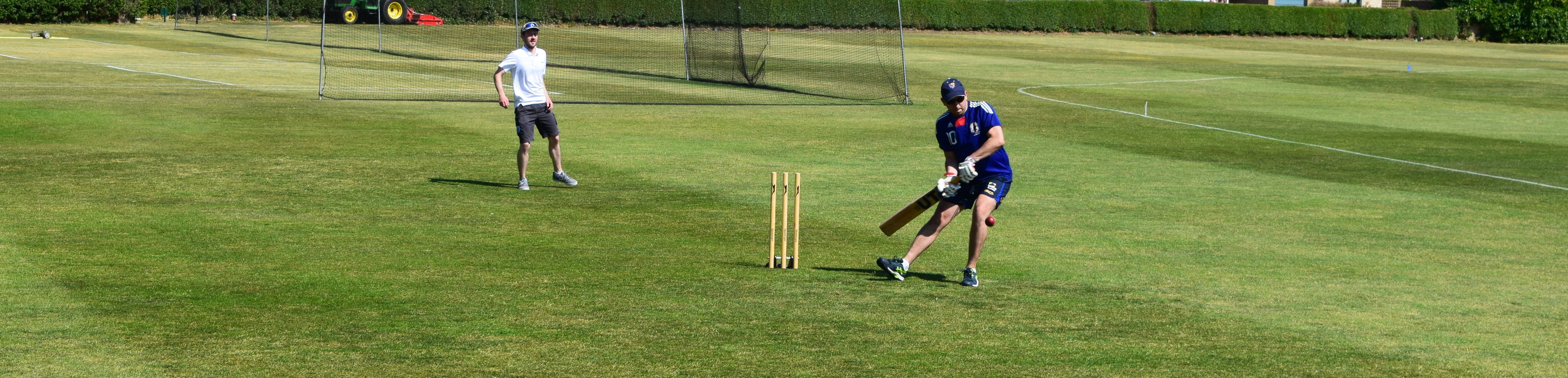 Student batting in cricket match