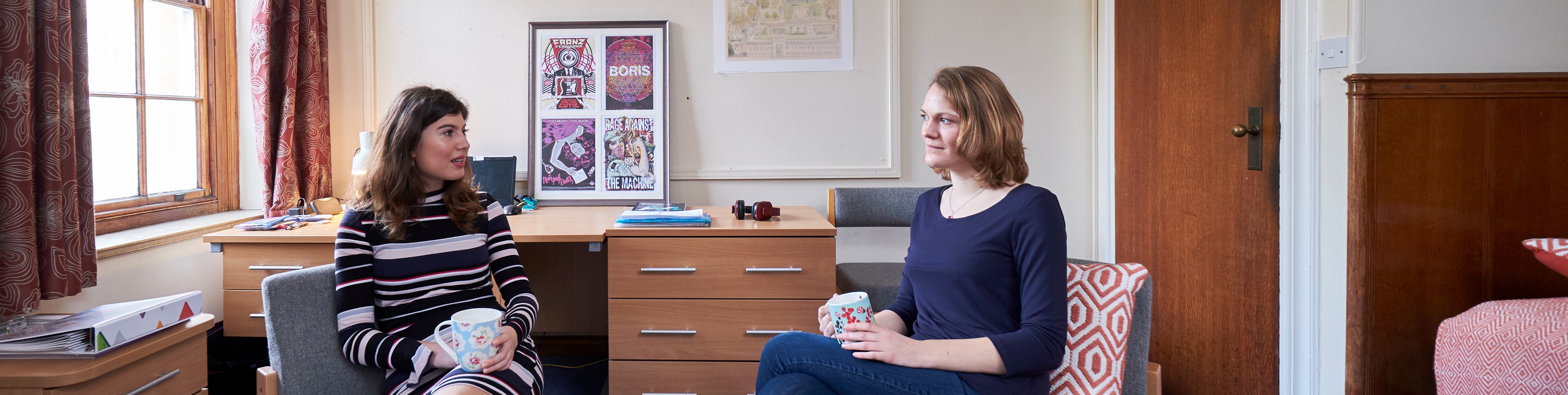 Two students in a student bedroom