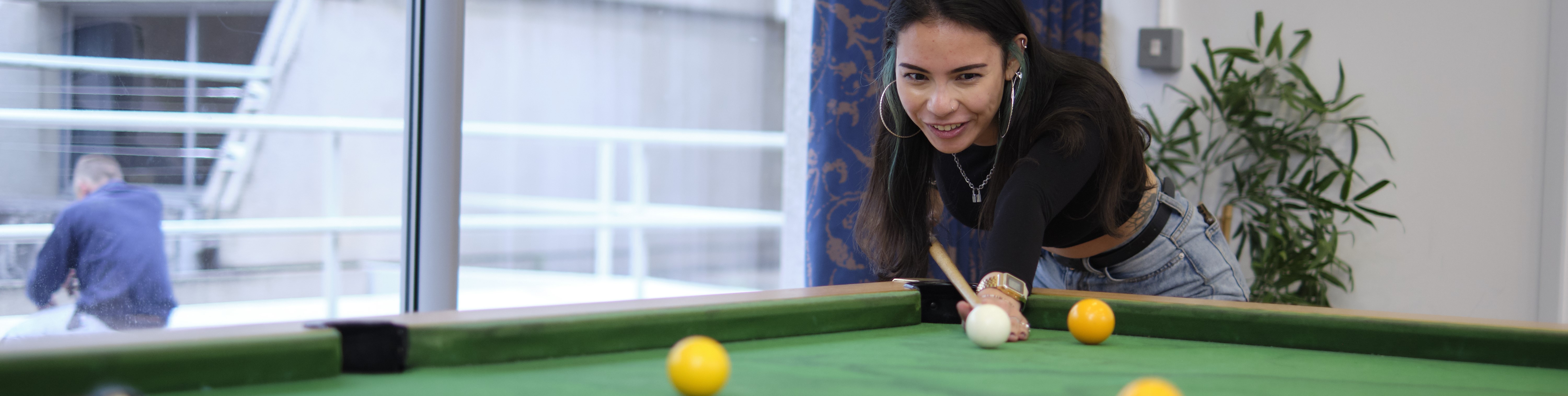 Student playing pool