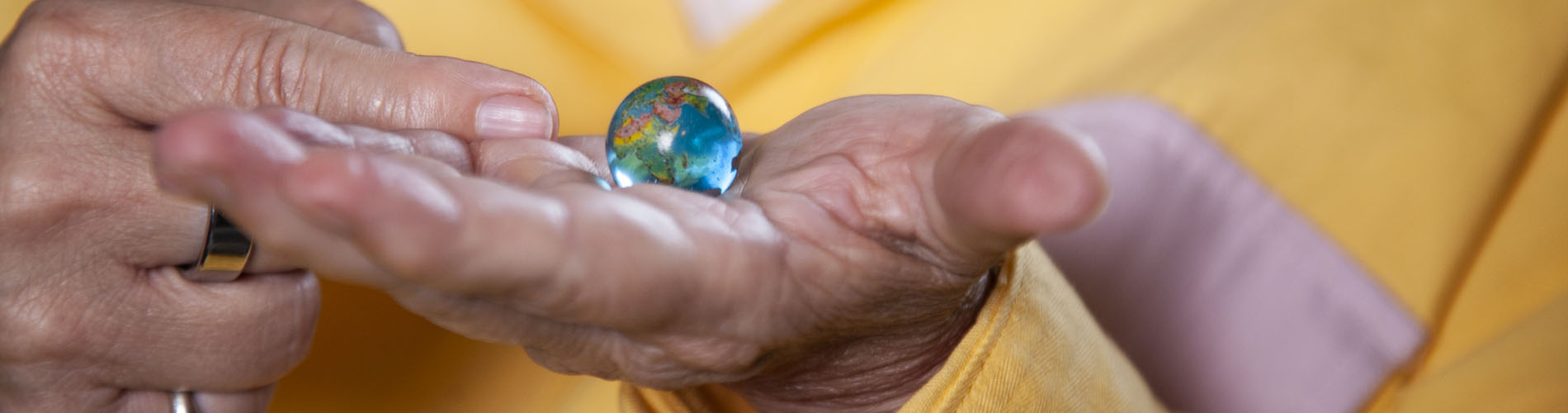 Hands holding a marble