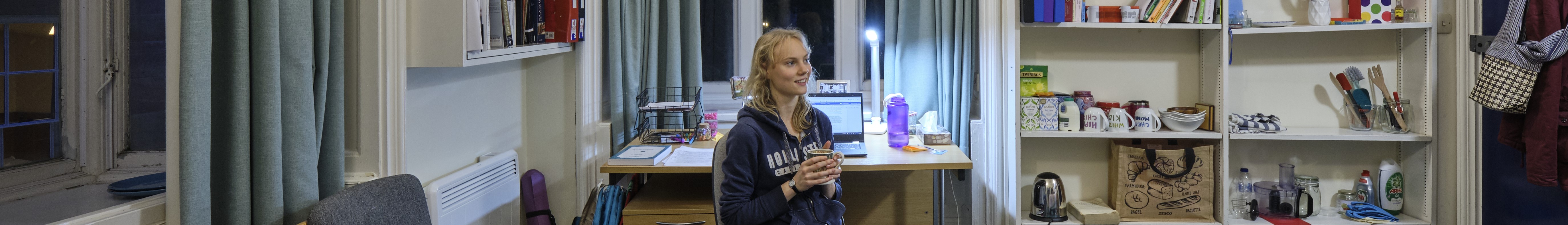 Student with cup of tea