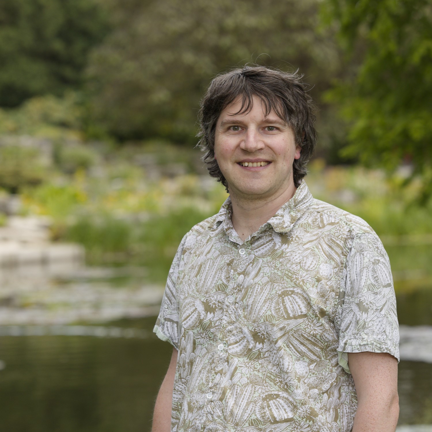 Smiling person in flowery shirt