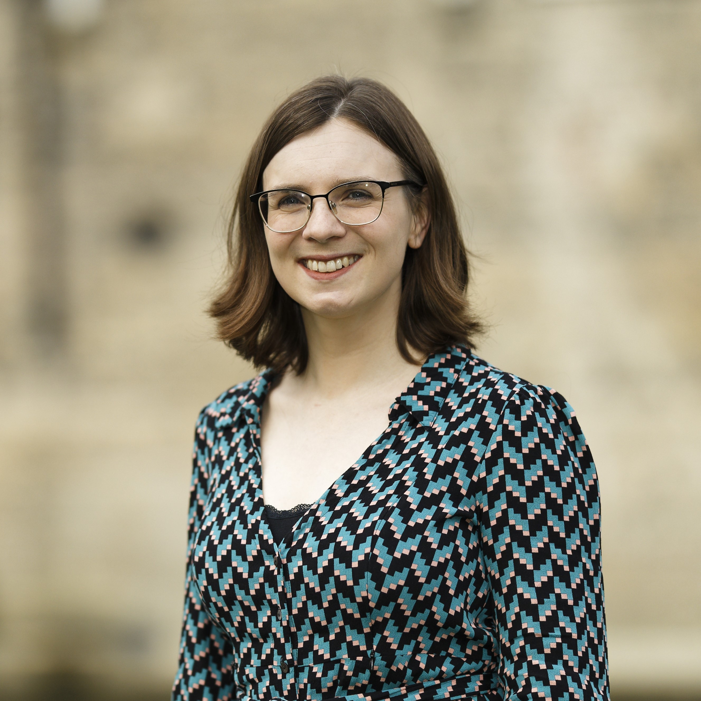Smiling person wearing glasses