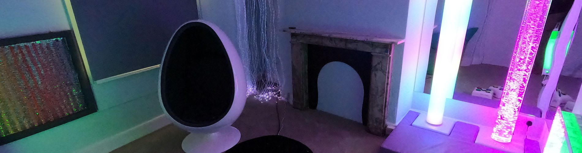 Dark room with coloured light tubes