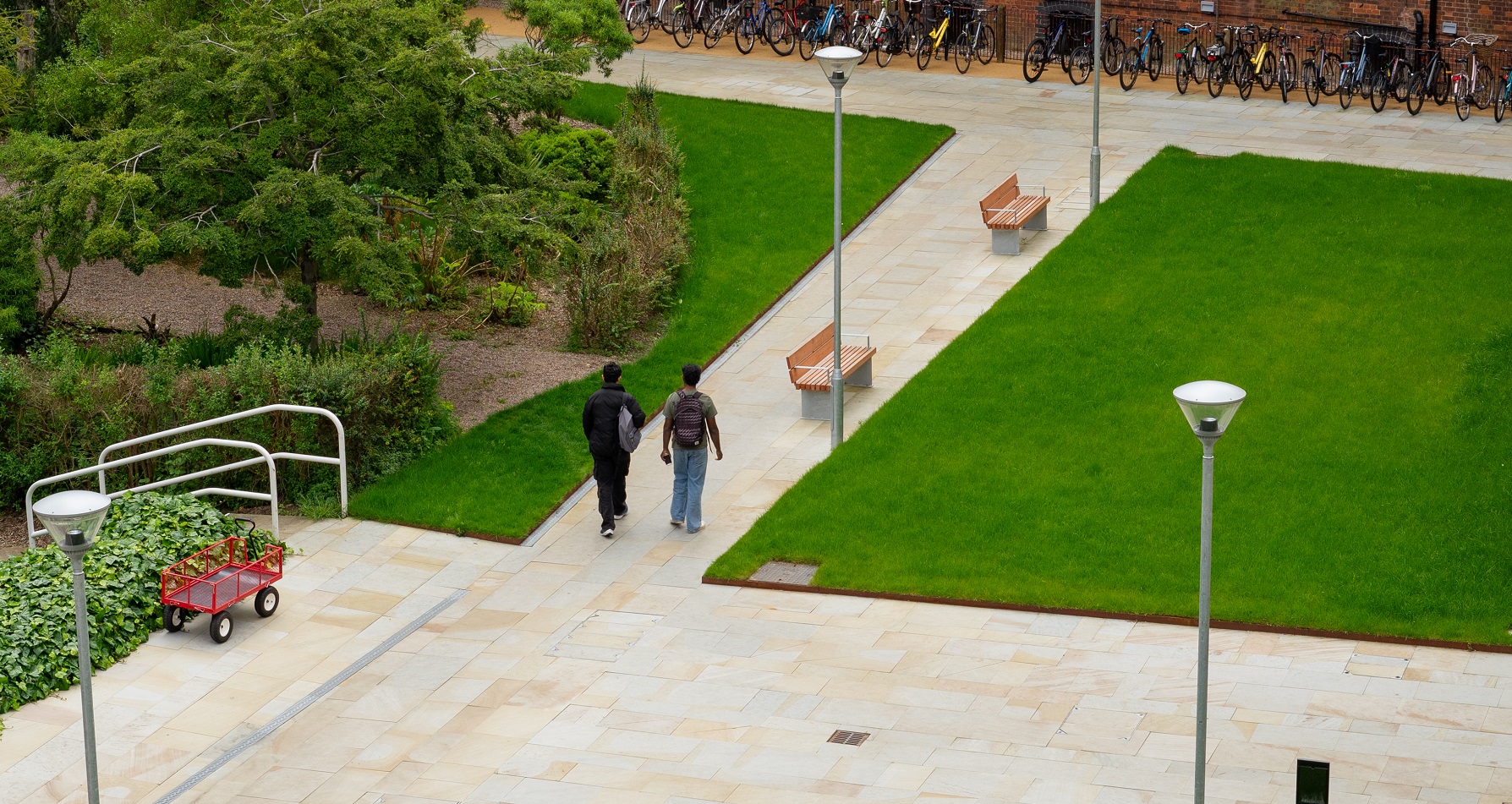 Two students walking through new court photographed from above