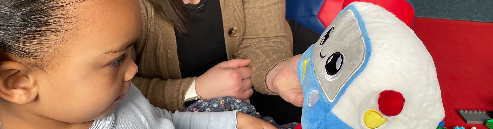 Child playing with an AI toy