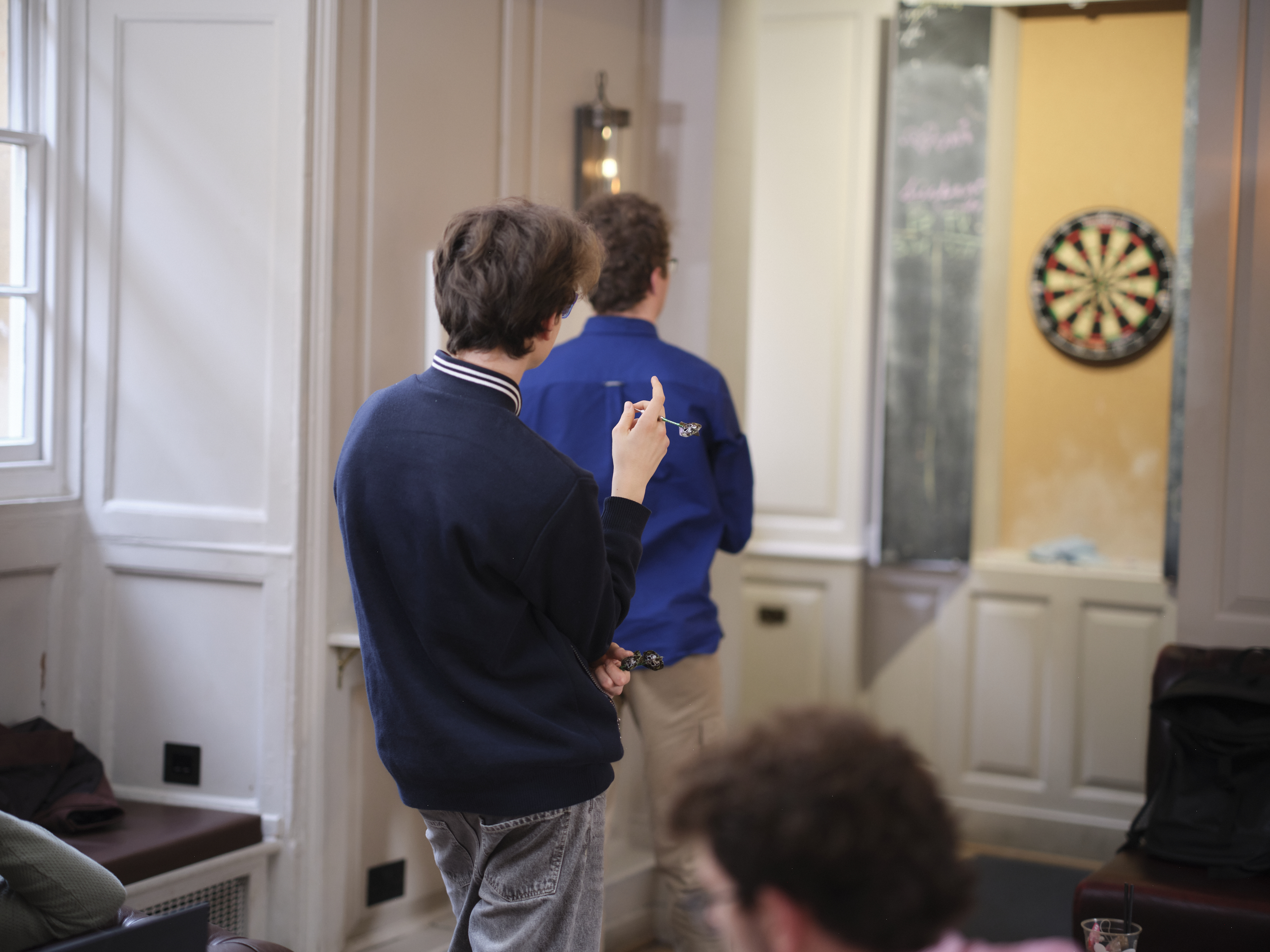 Students playing darts