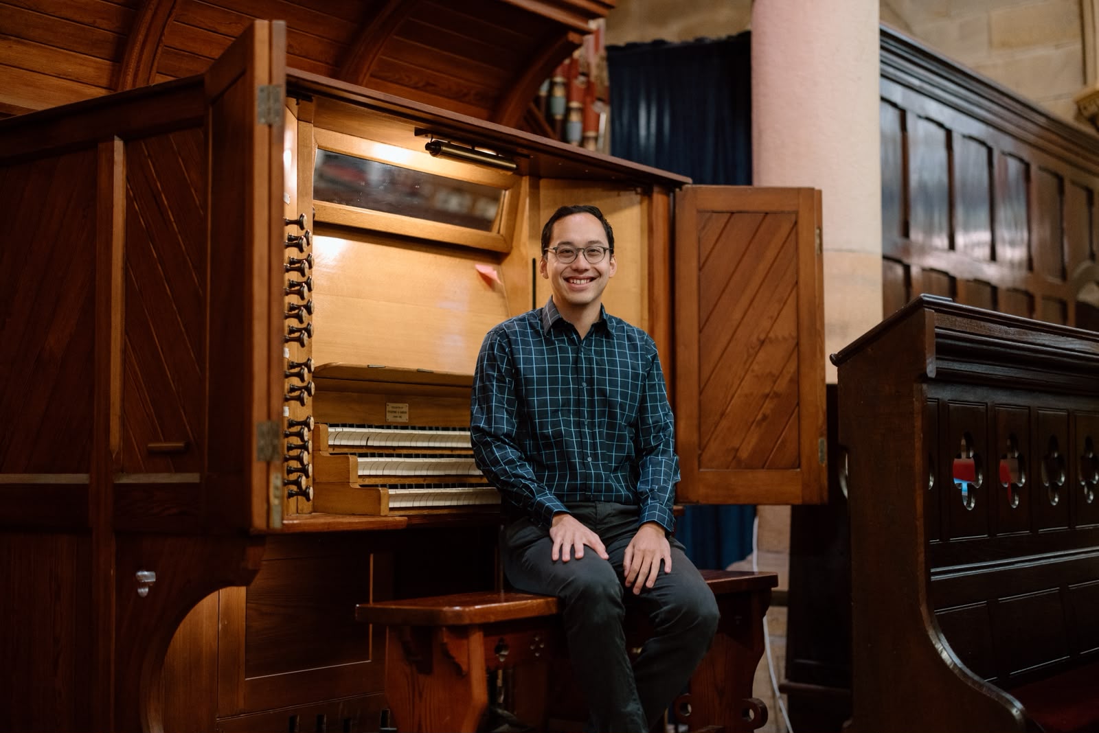 Stephen Watson sat at an Organ