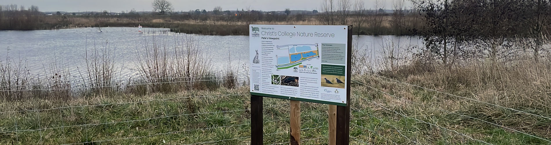 Notice board with water in the background