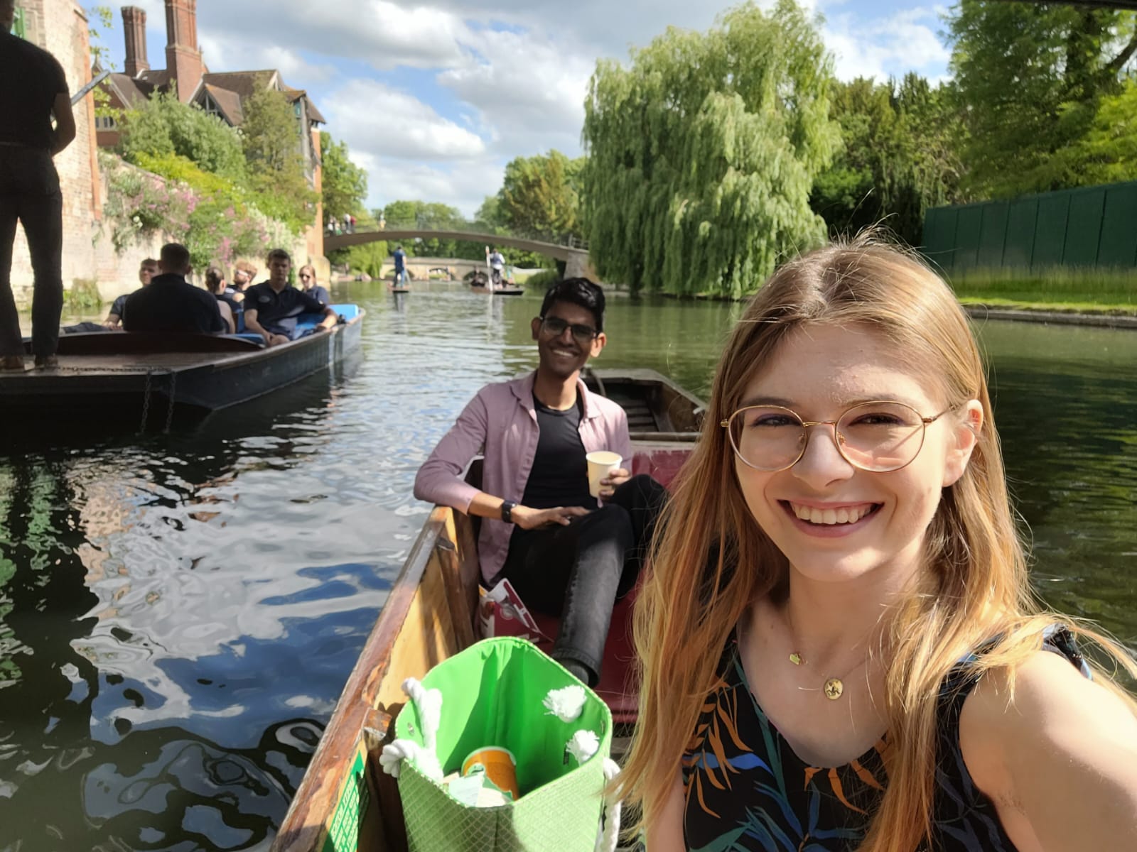 Oliwia in a punting boat, with another student behind her