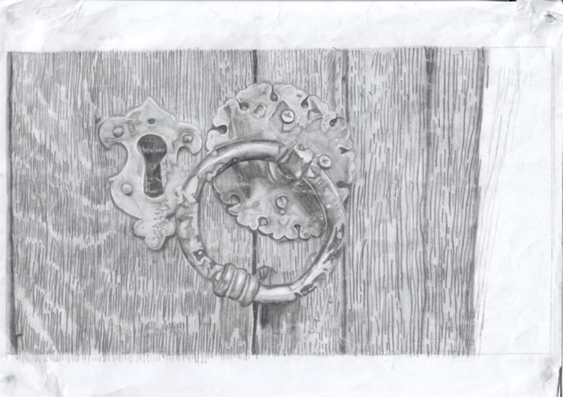 Detailed study of an old-fashioned ring door handle and keyhole