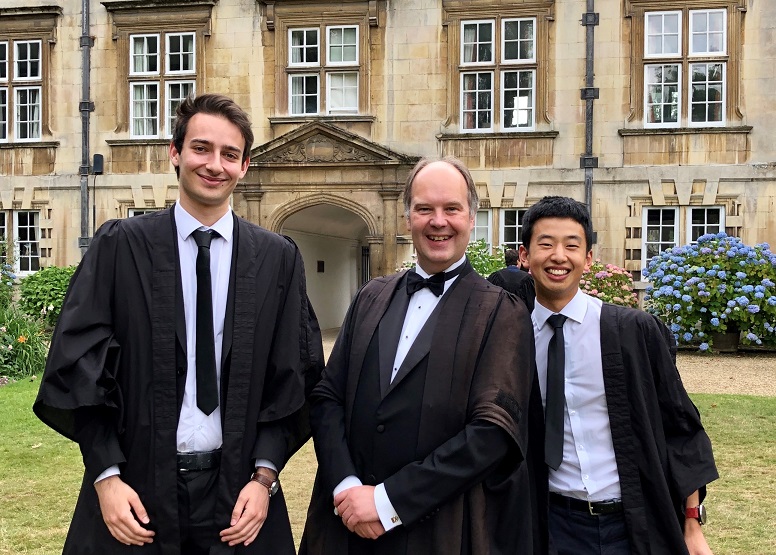 Three men in gowns