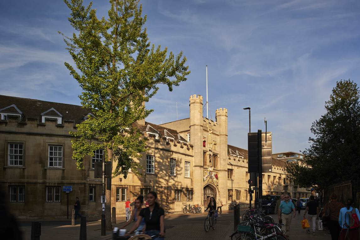 Main gate on St Andrew's Street with cyclists passing