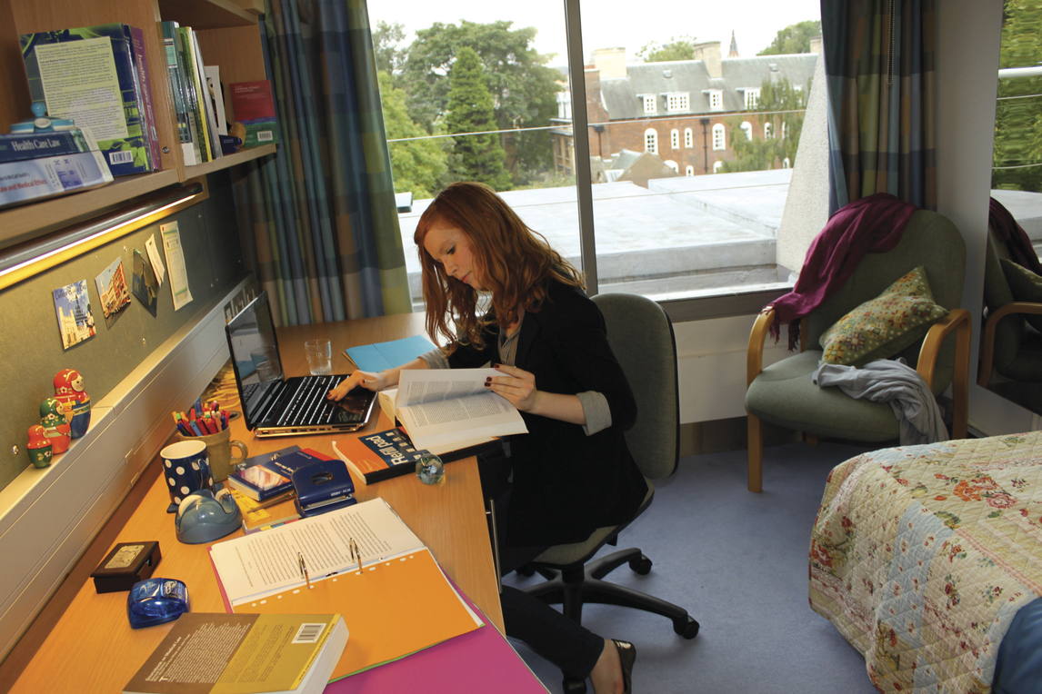 Student working at desk in New Court room