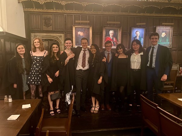 A group of friends stood in a line in Formal hall