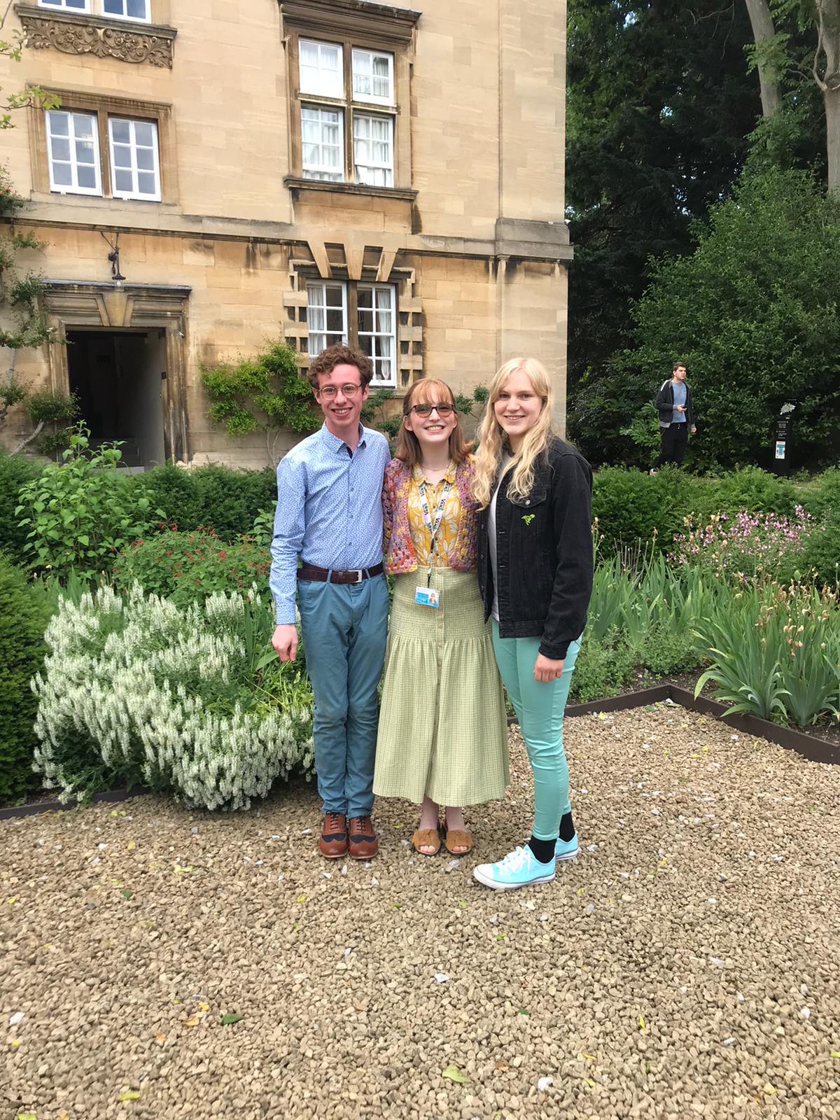 Three students in front of an old buiding in Third Court