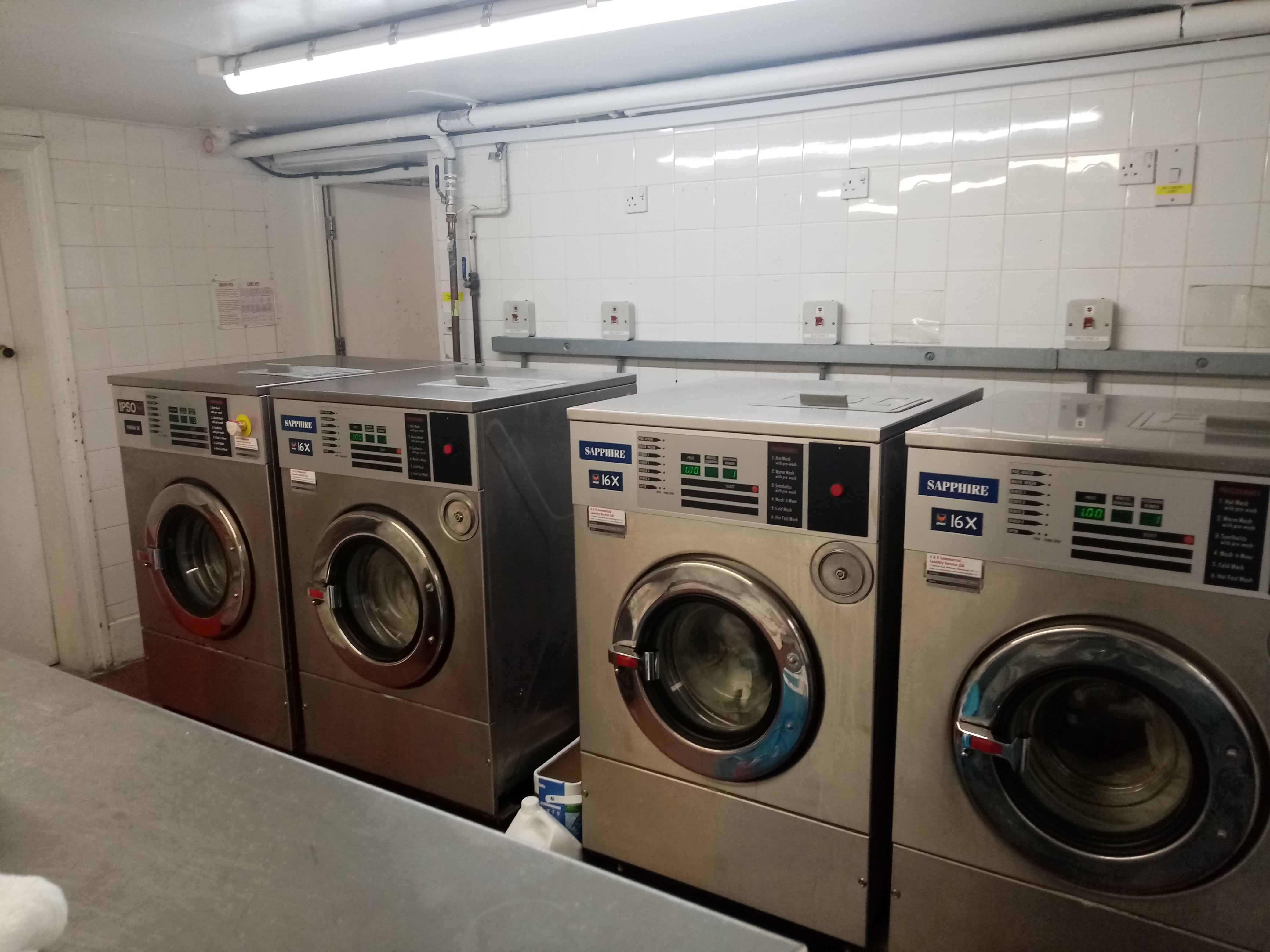 Four large washing machines