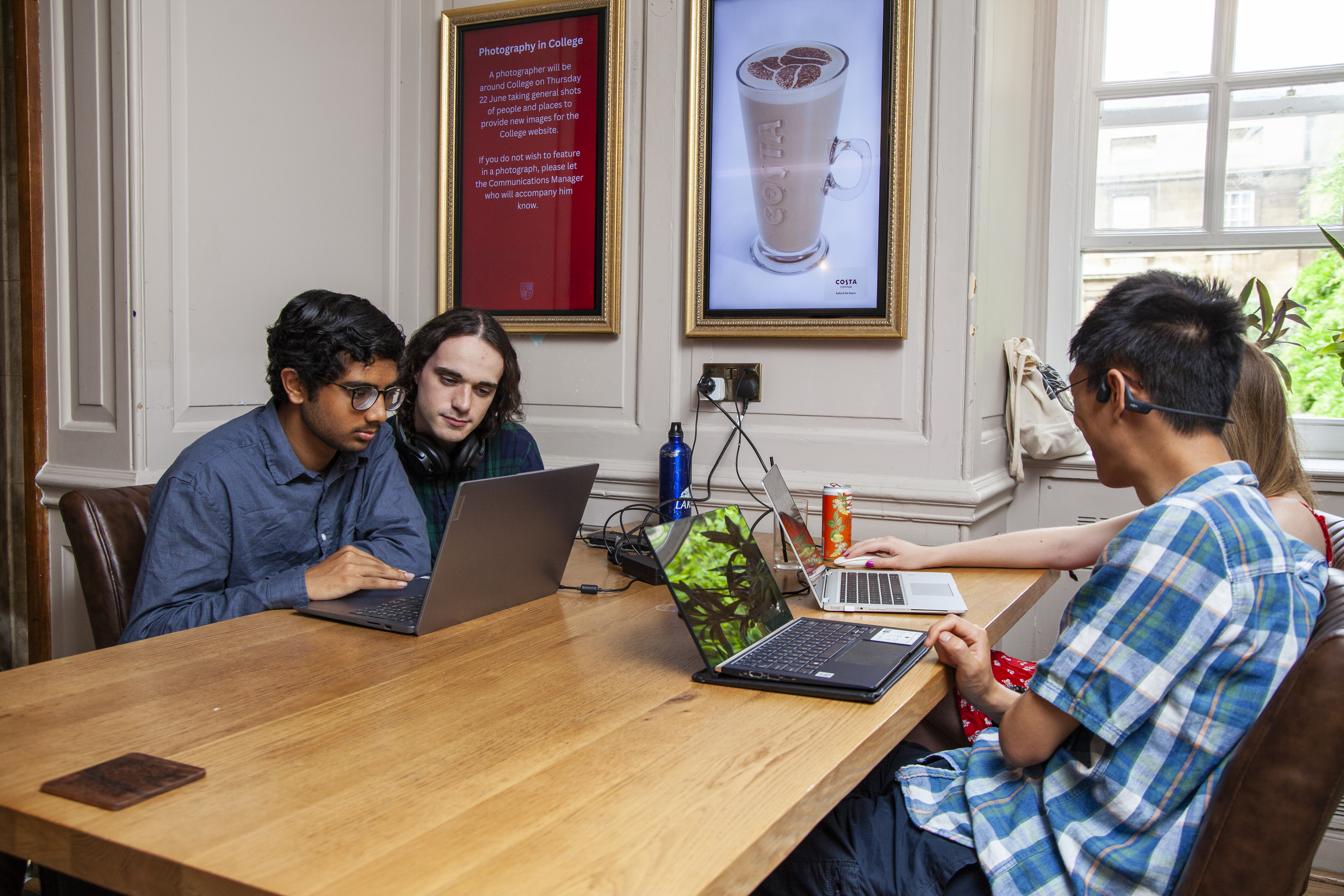 Students around table in bar