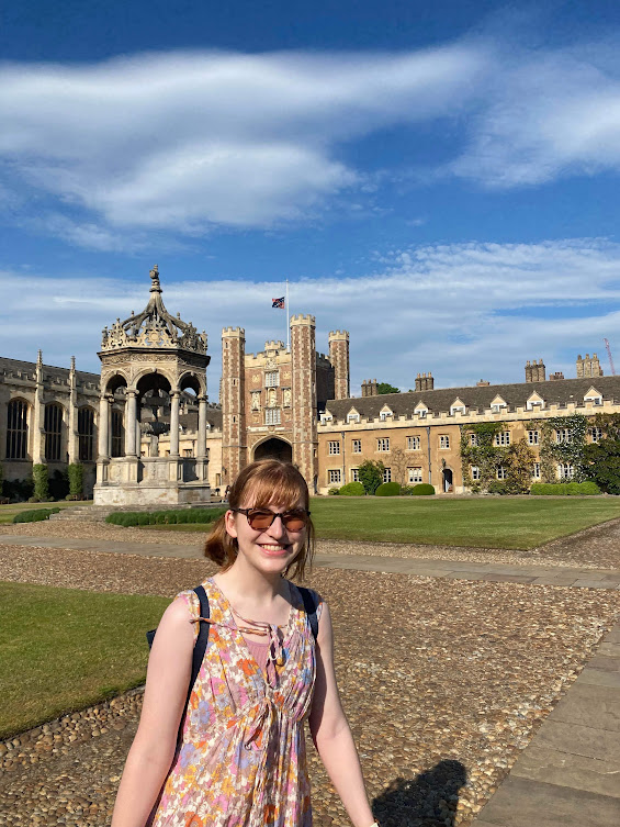 Sohie with trinity college court in the background, including a big well