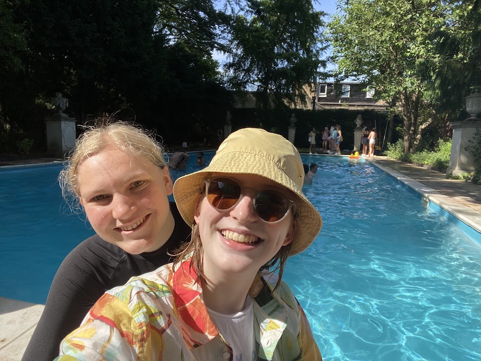 Two students sat by the College Pool