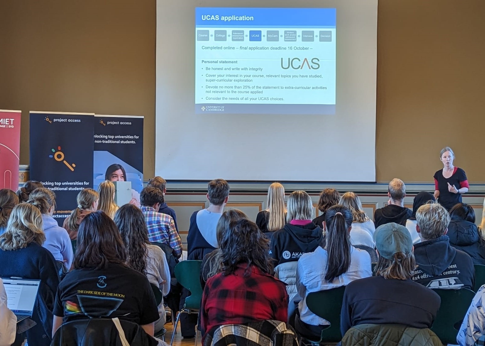 Seated group of students listening to a presentation