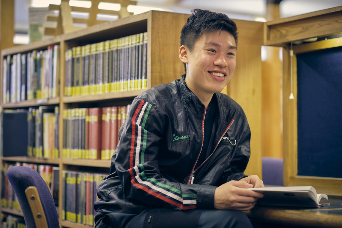 Student at desk in the library