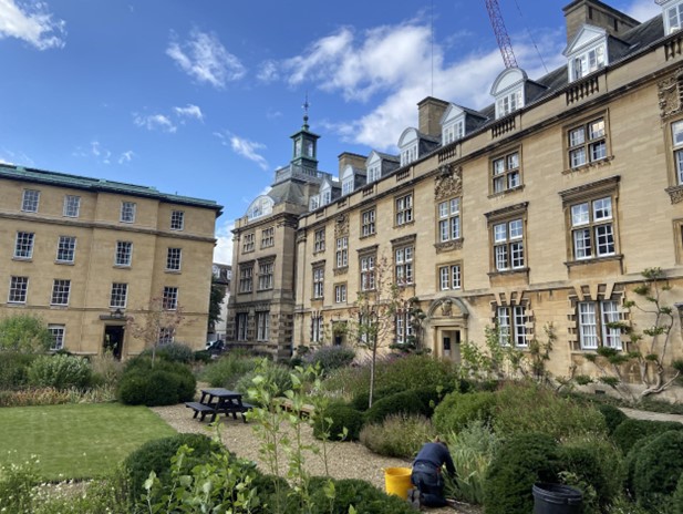 Third court, with a gardener doing her work in the foreground