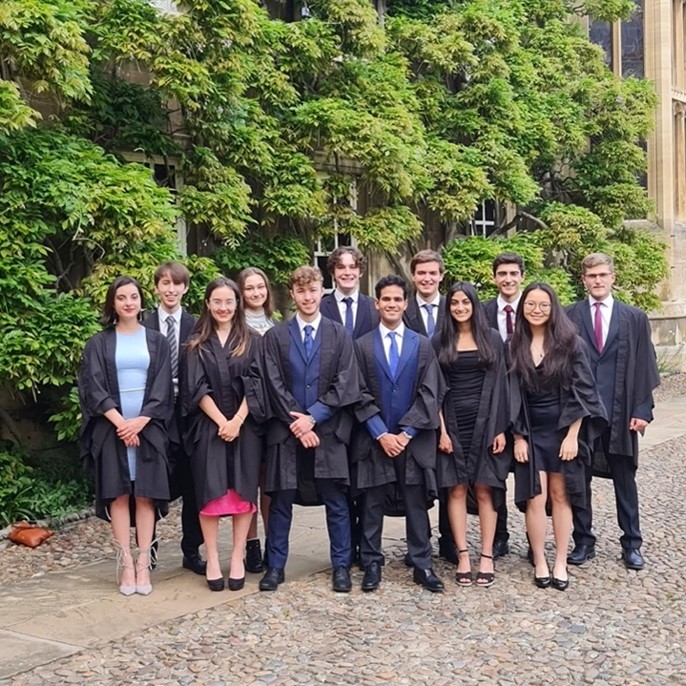 A group of students in gowns, in First Court