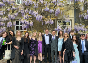 A large group in front of the wyseria plants in first court. 