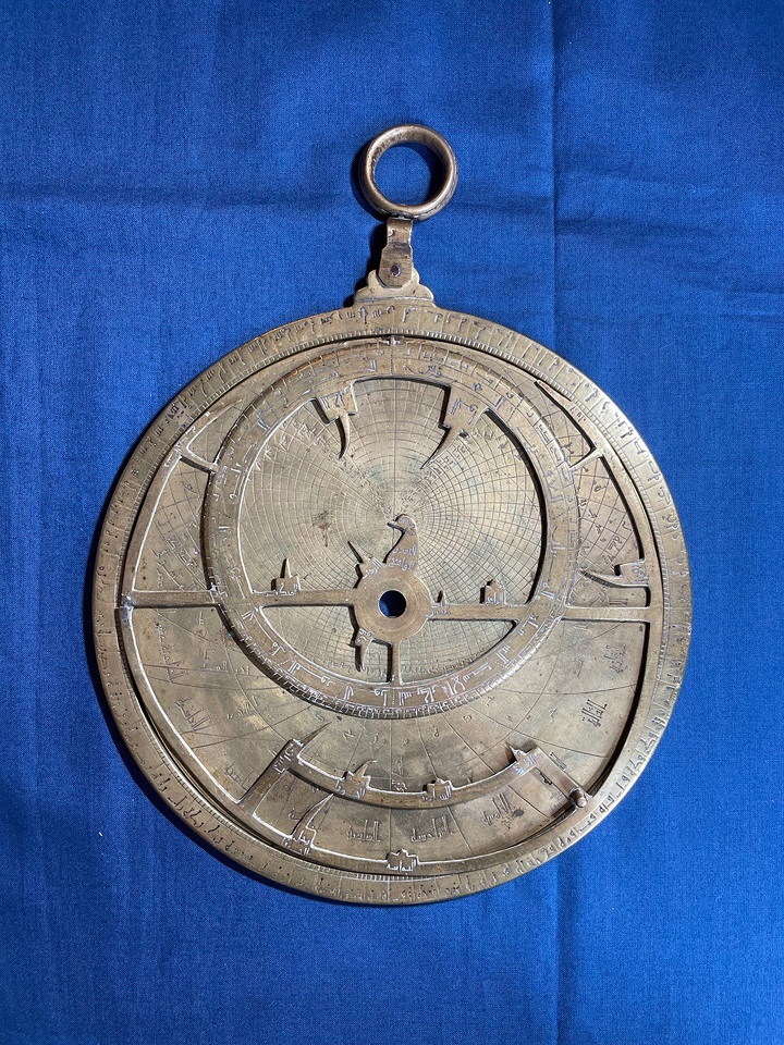 Astrolabe on blue background