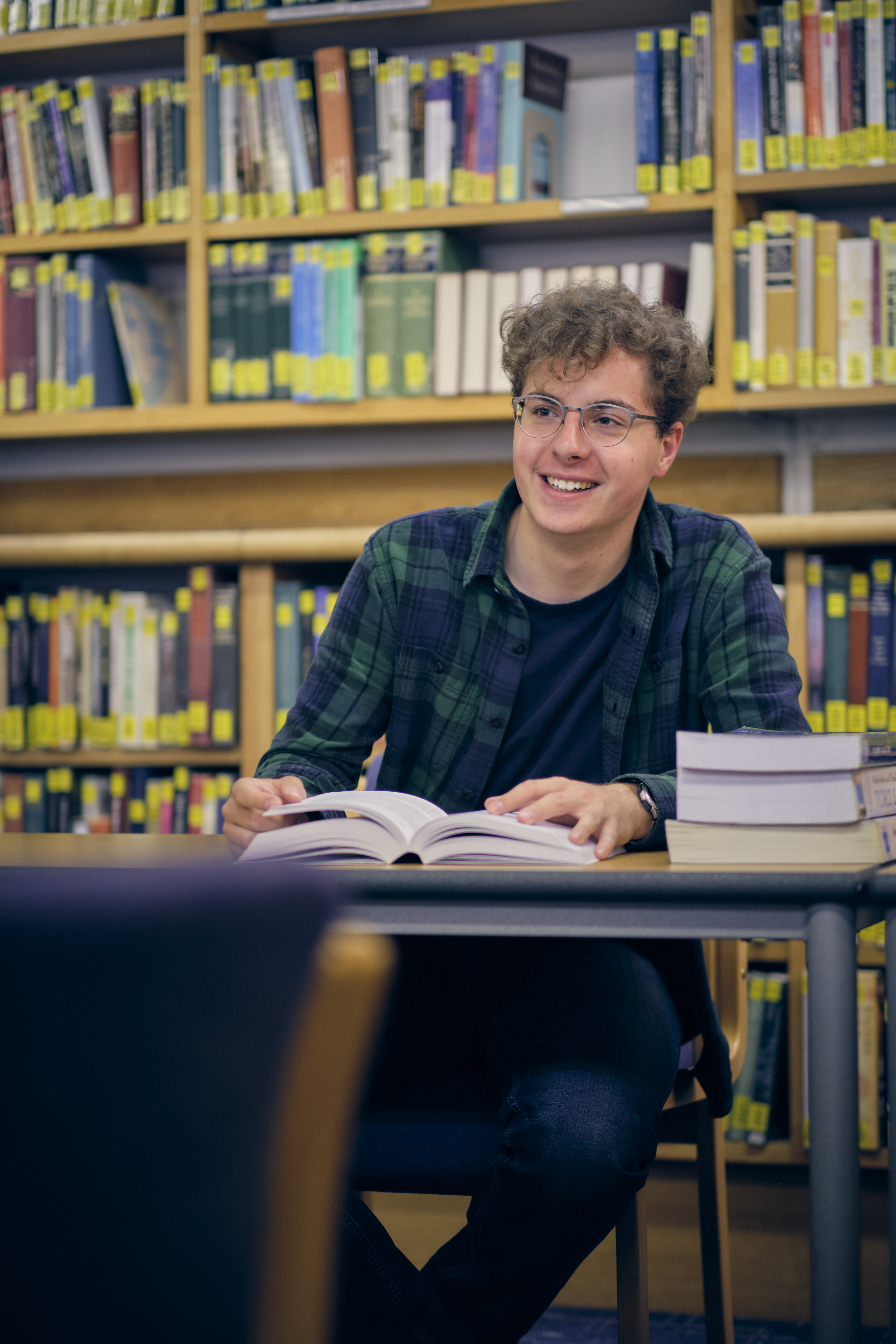 Student at desk in library