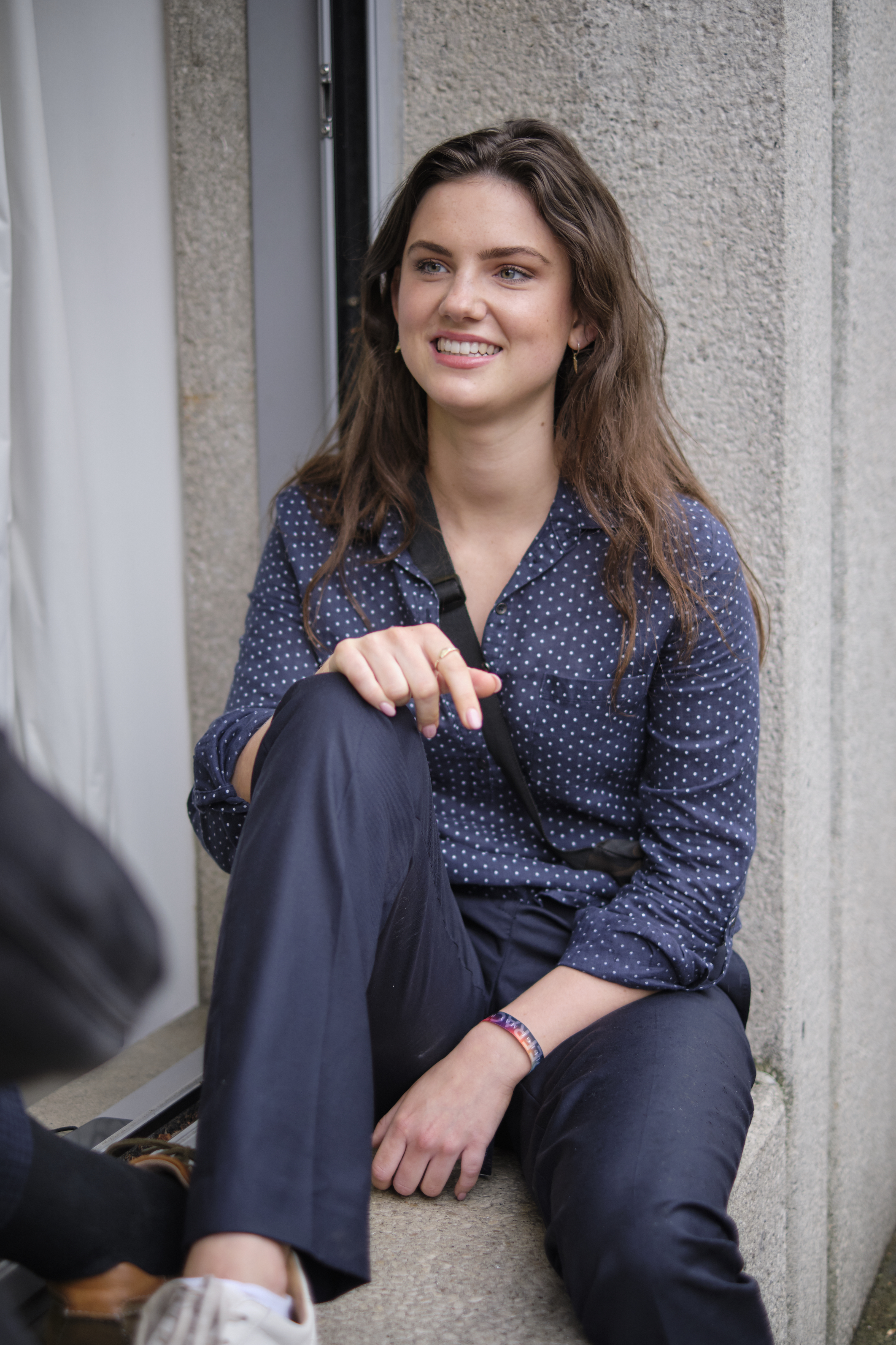 Student sitting in window