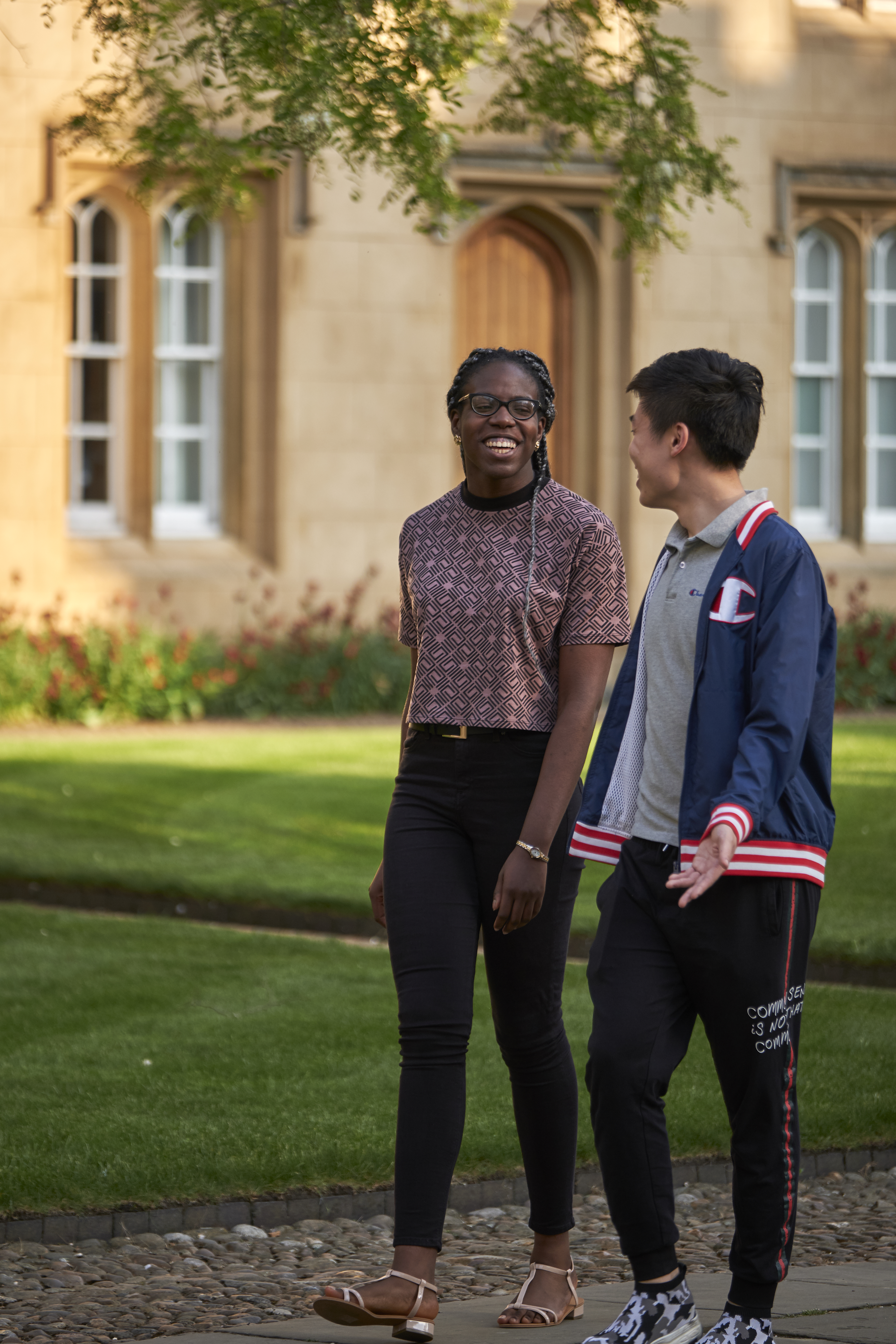 Two students walking in Second Court