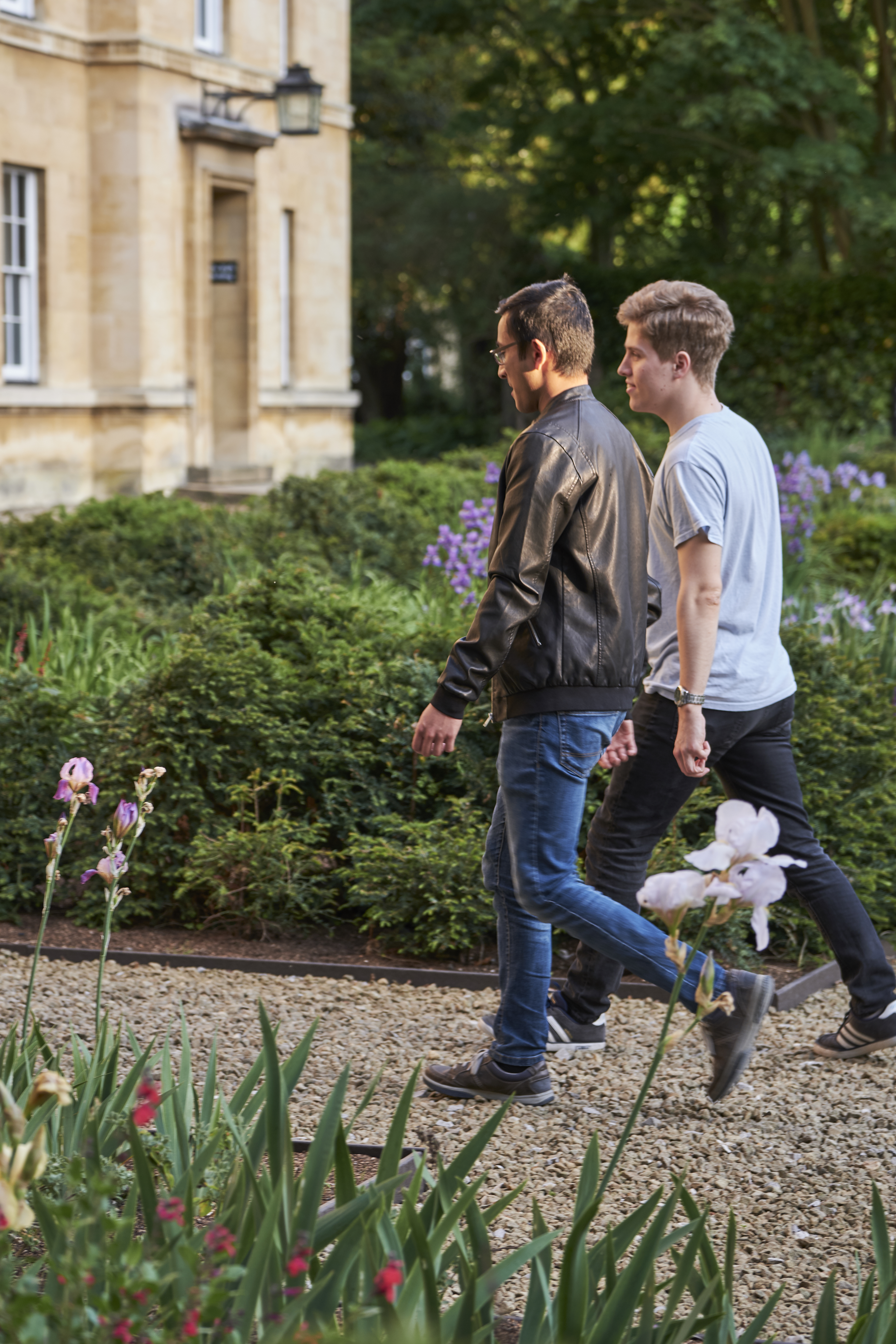 Two students walking in Third Court