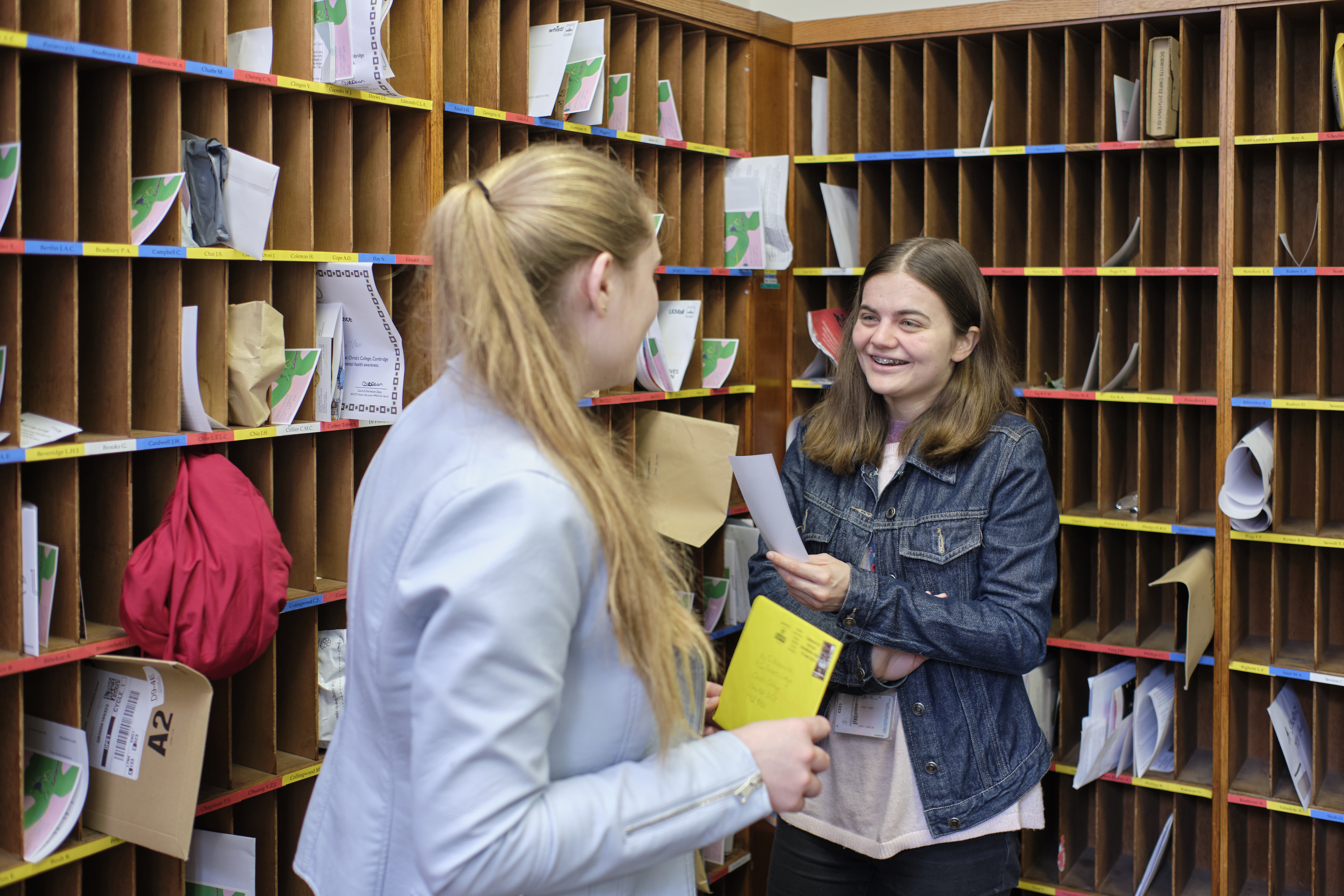 Students chatting by the pigeon holes