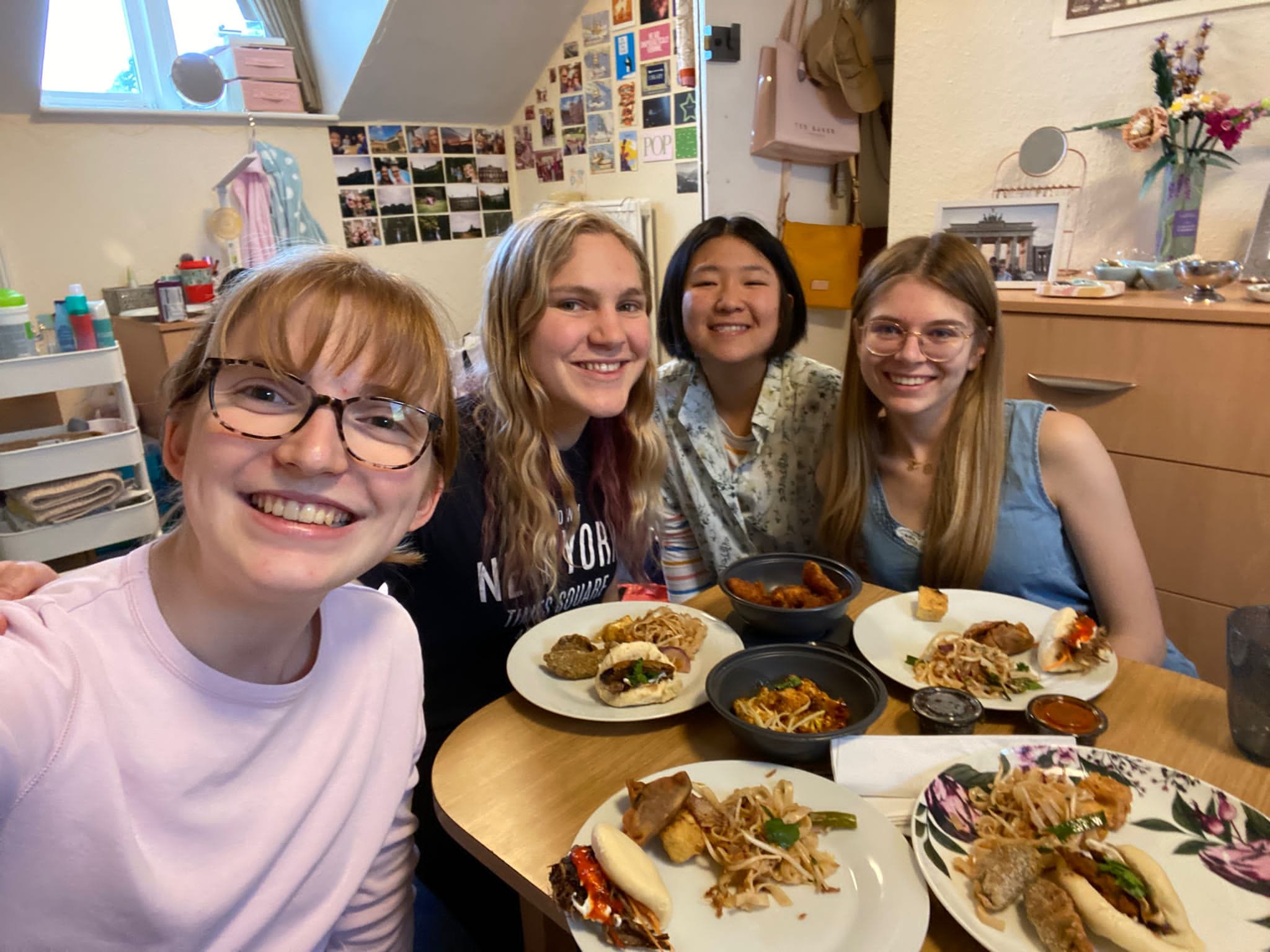 Selfie of four students with food