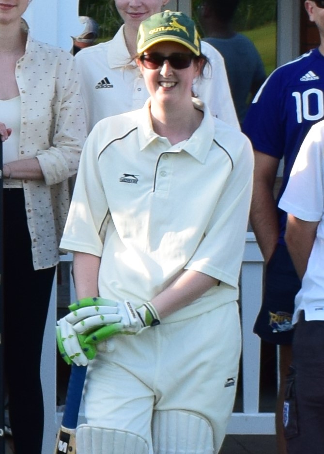 Person in cricket whites with a bat