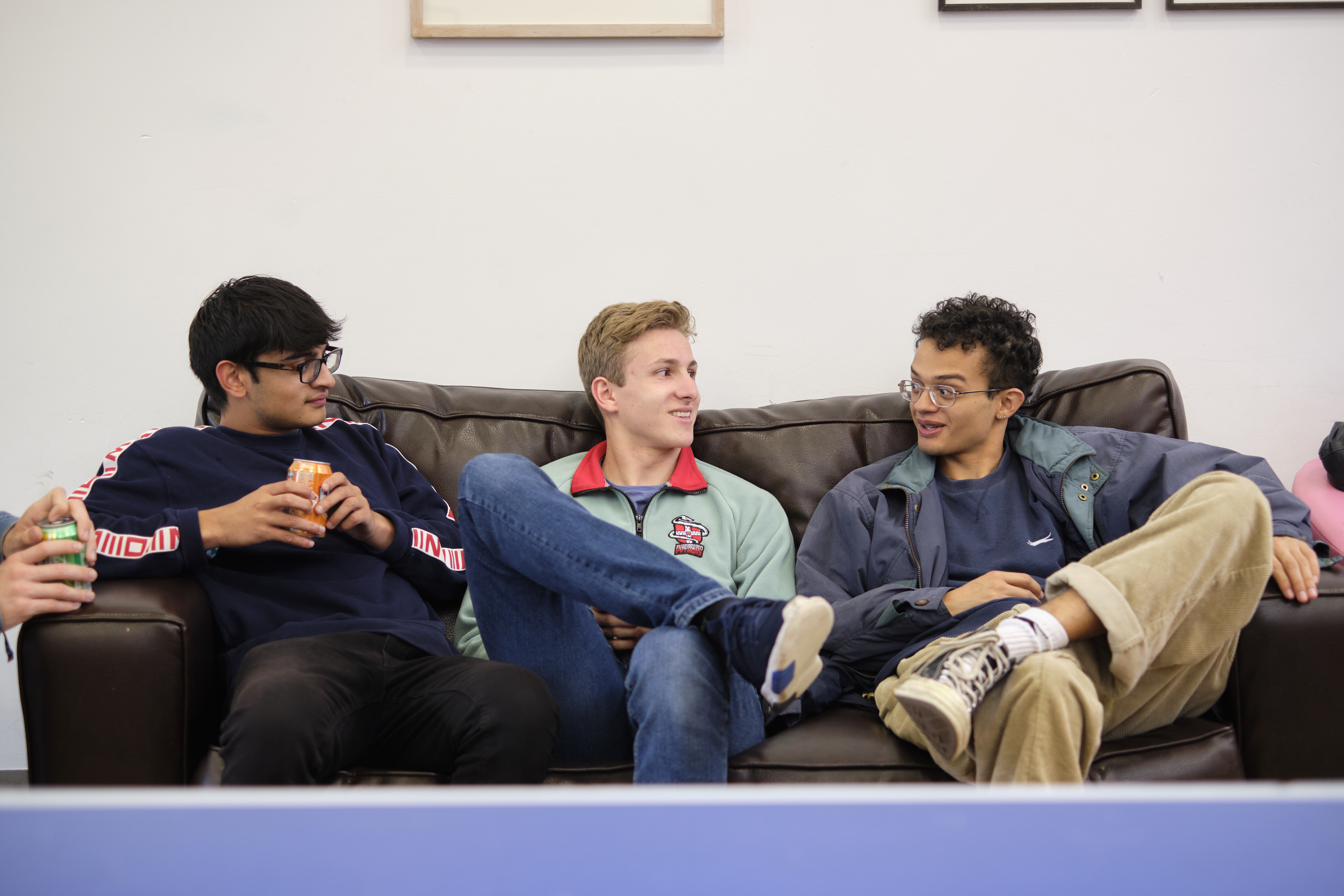 Three students on sofa