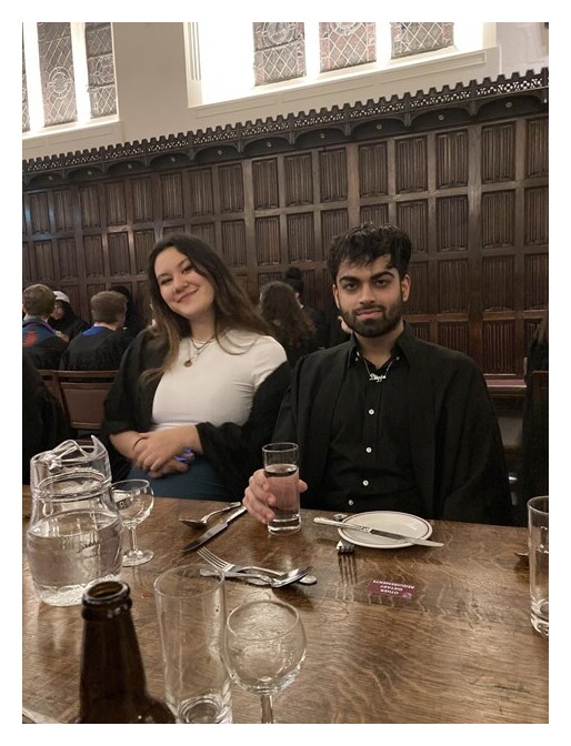 Two students sat at a table in Formal Hall
