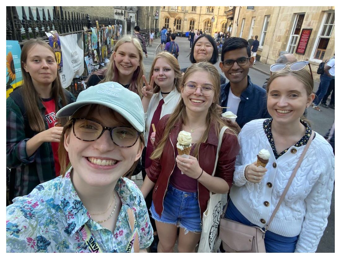 A selfie of a group of friends, some holding ice cream