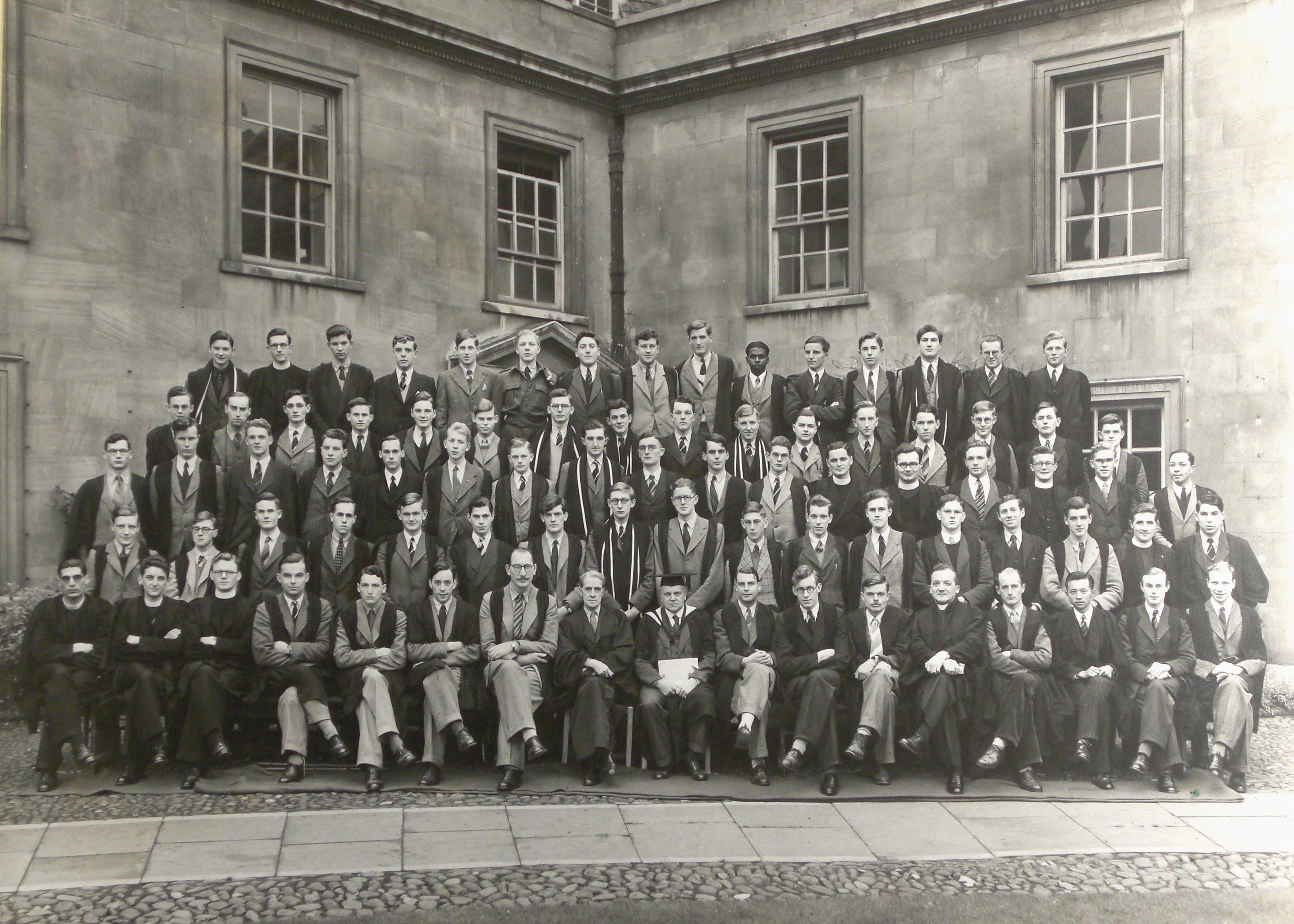 Seated men wearing gowns