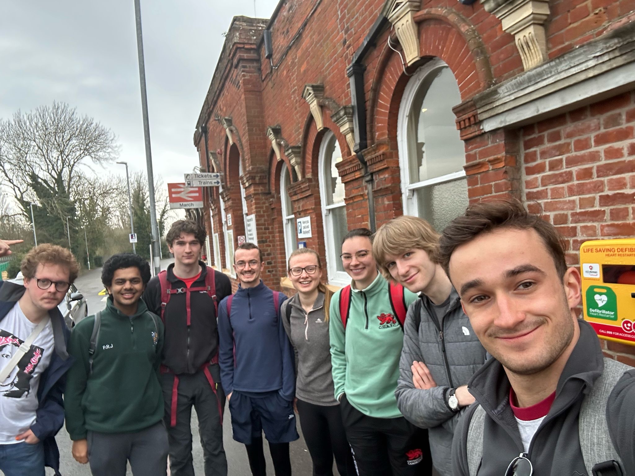 Group of people in front of March railway station